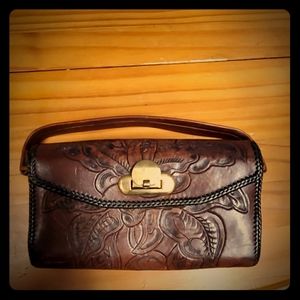 A bown small leather hand bag.